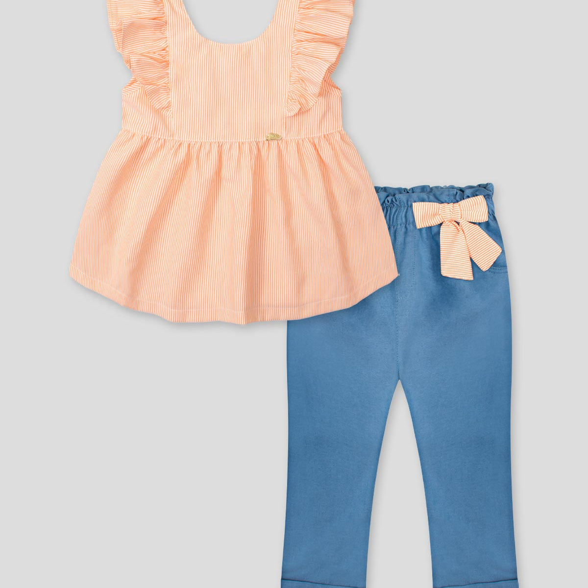 Conjunto blusa de líneas naranjas con bolero en manga y leggins chambray con detalle de moño para bebé niña