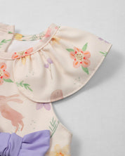 Conjunto blusa con estampado de flores, conejitos, con moño lila y leggins blanco para bebé niña