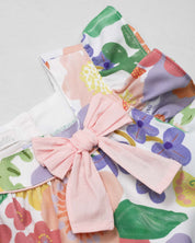 Conjunto blusa con estampado de flores de mangas con boleros, moñito rosa y leggins para bebé niña