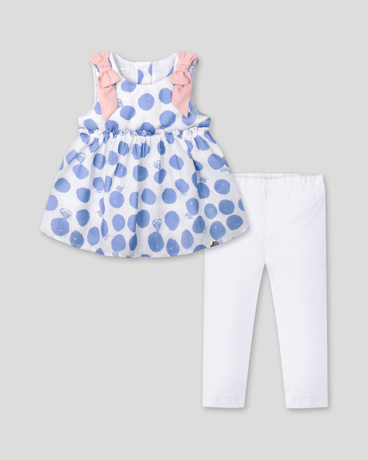 Conjunto blusa con estampado de lunares azules y leggins blanco para bebé niña