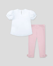 Conjunto blusa blanca con bolsito estampado y leggins rosa con moñitos para bebé niña