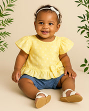 Conjunto blusa amarilla con estampado de flores, moño y short azul para bebé niña