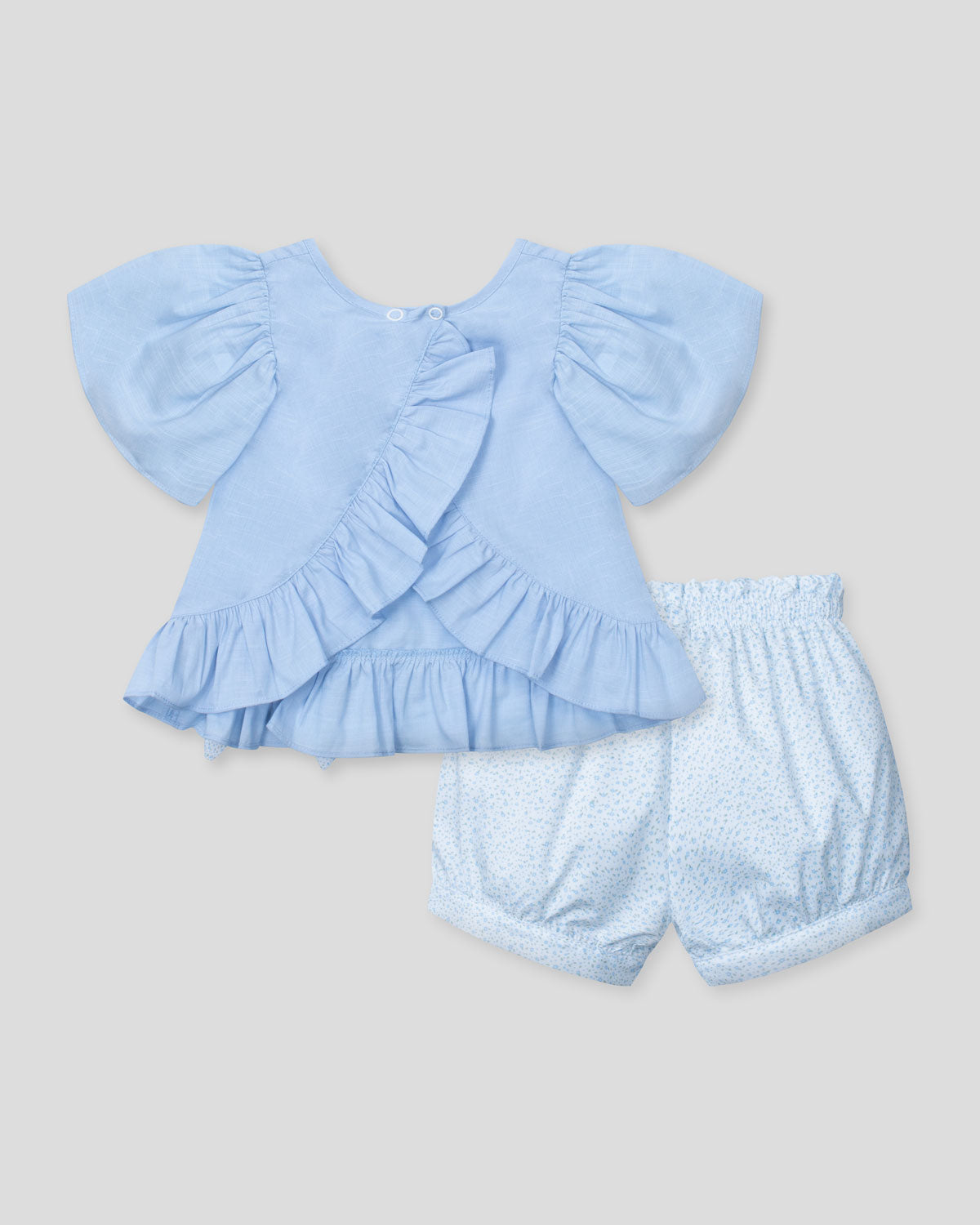 Conjunto blusa azul con moñito, boleros y short estampado para bebé niña