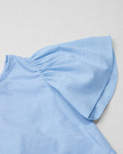 Conjunto blusa azul con moñito, boleros y short estampado para bebé niña