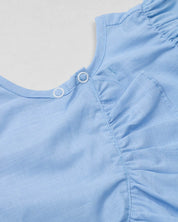 Conjunto blusa azul con moñito, boleros y short estampado para bebé niña