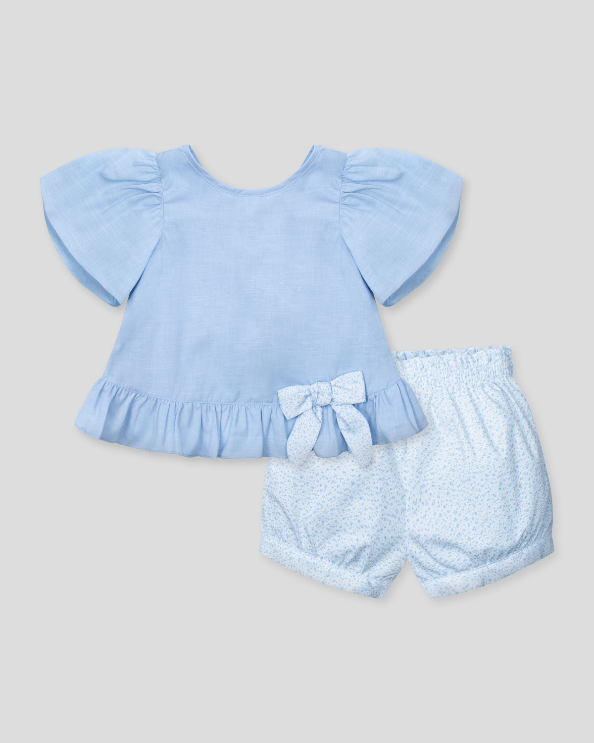 Conjunto blusa azul con moñito, boleros y short estampado para bebé niña
