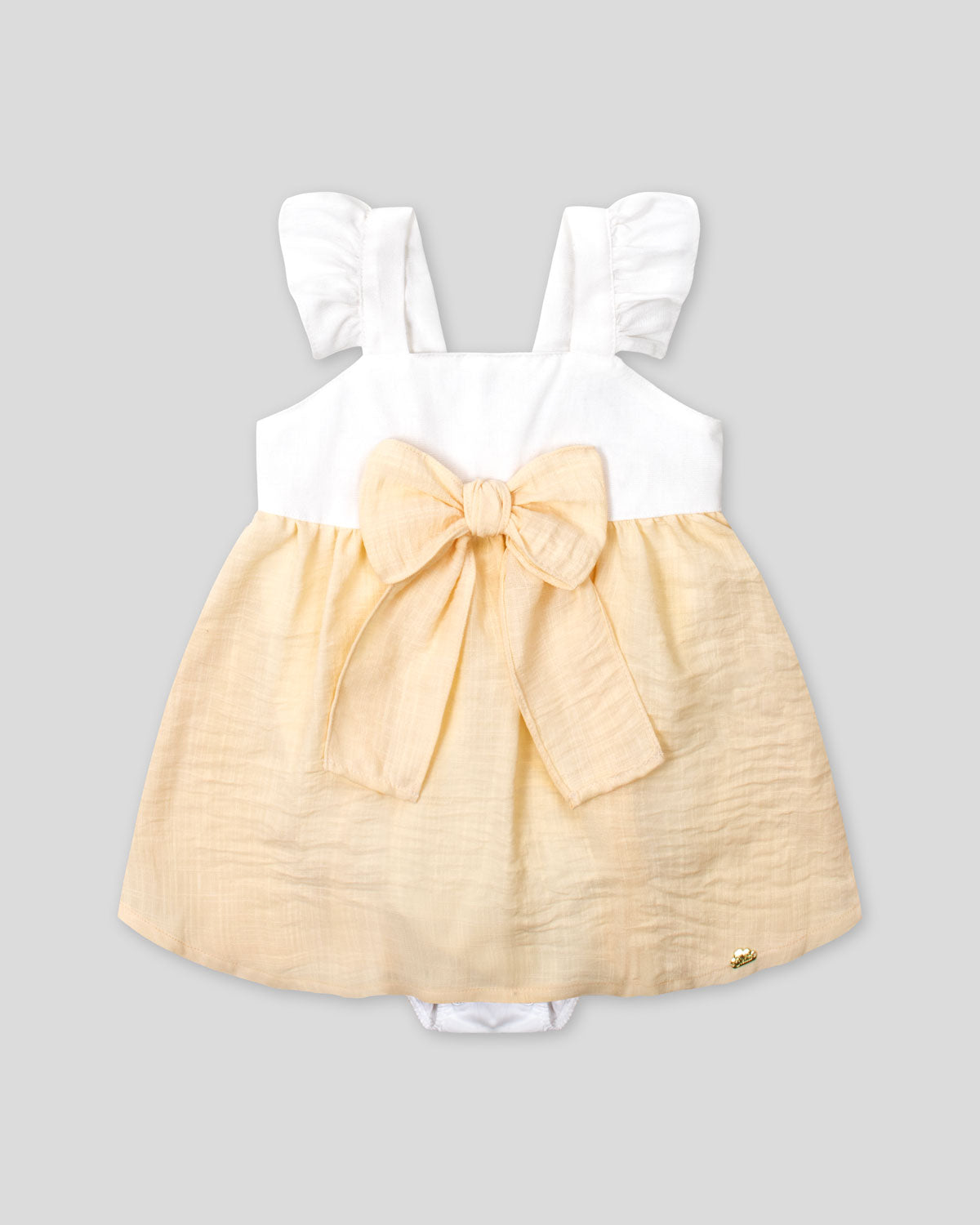 Vestido body en lino blanco y amarillo con detalle de moño para bebé niña