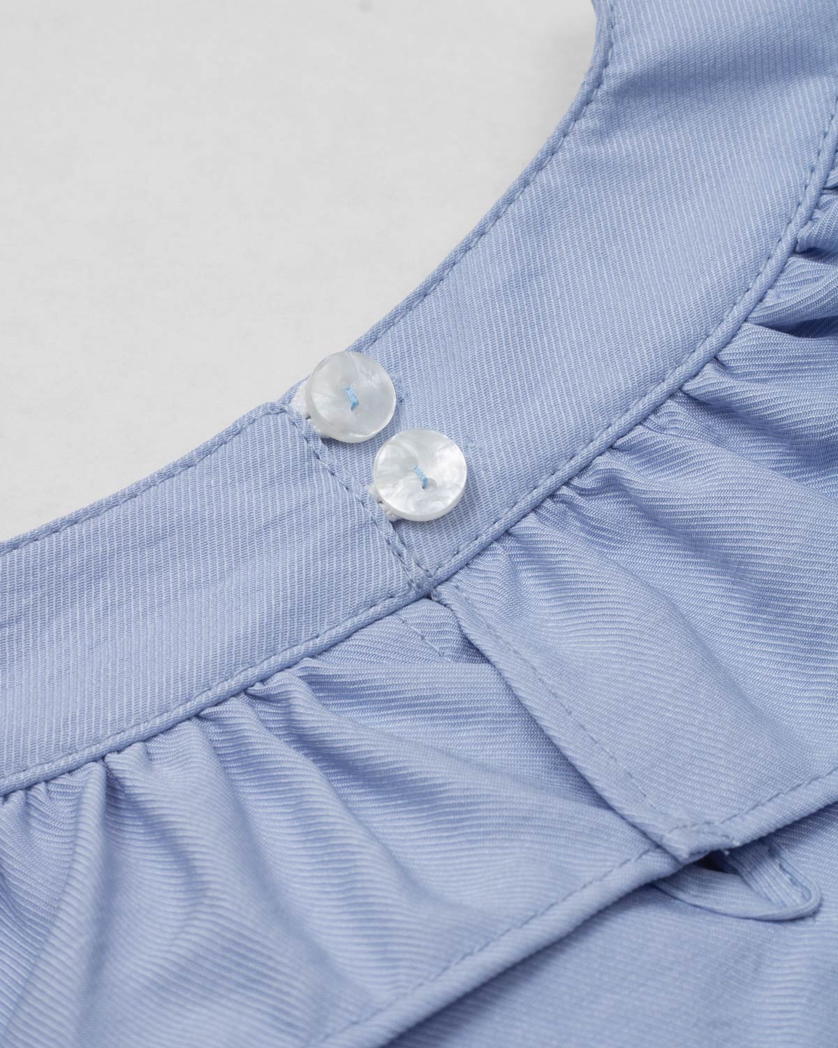 Vestido body azul con boleros y moñito rosa para bebé niña