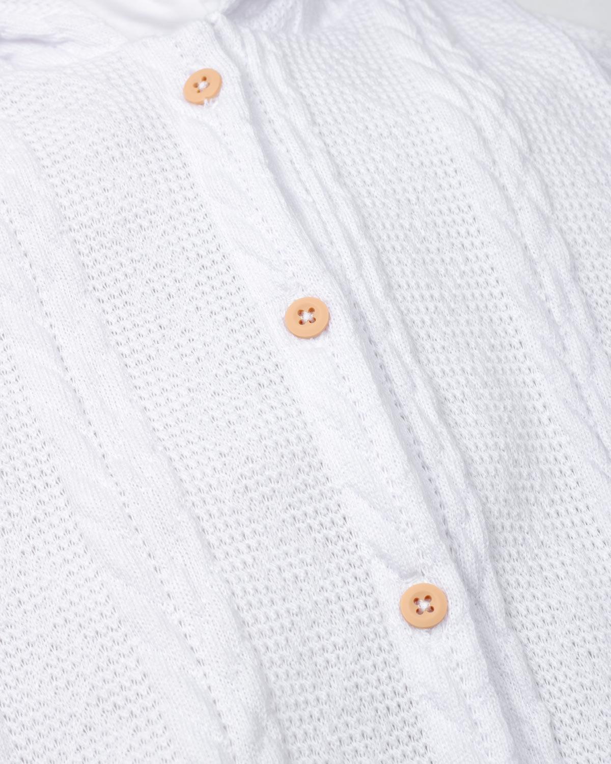 Pijama enteriza blanca de gorrito con pompones para bebé niña