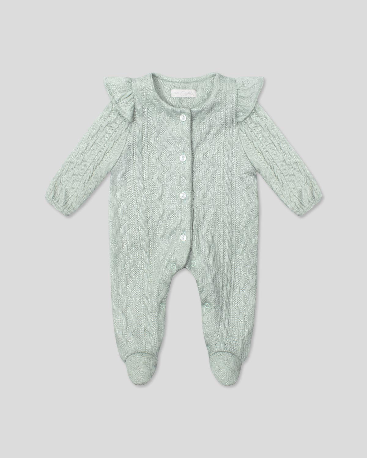 Pijama enteriza en tela tejida verde con botones y boleritos en hombro para bebé niña