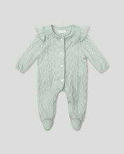 Pijama enteriza en tela tejida verde con botones y boleritos en hombro para bebé niña