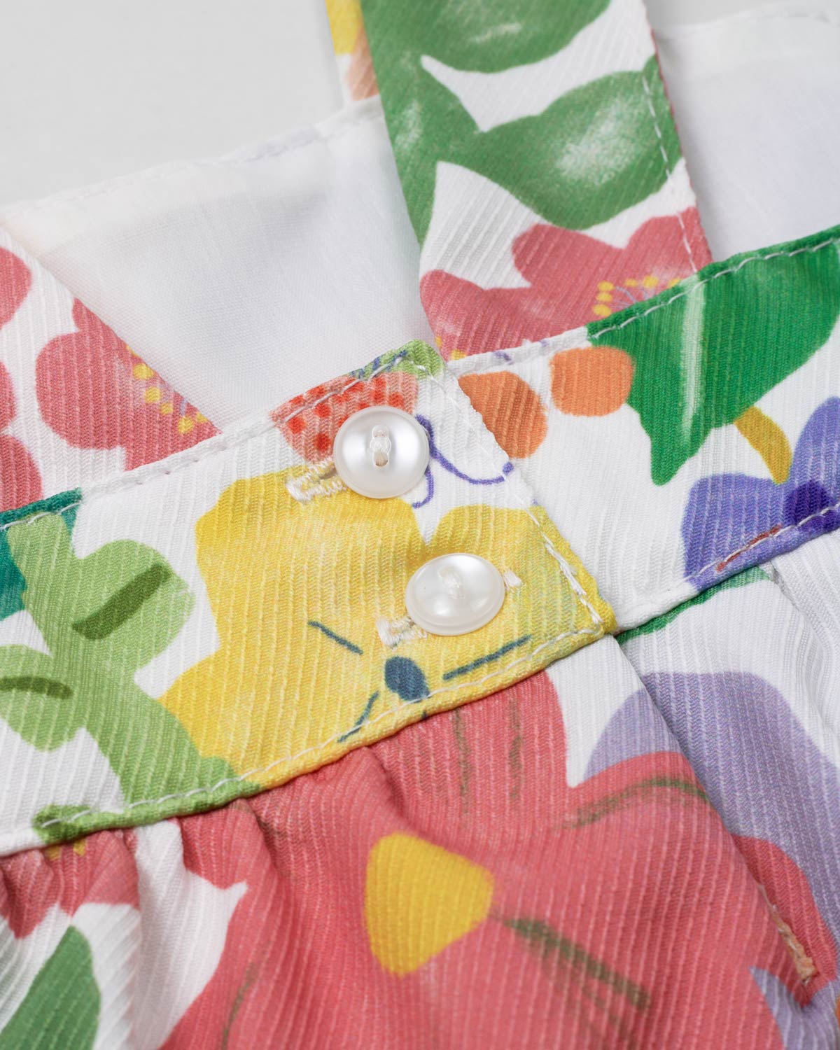 Conjunto blusa de tiras con estampado de flores, boleros y leggins rosado para niña