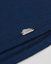 Conjunto blusa azul con bolero, moño de rayas y leggins blanco para niña