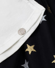 Conjunto camiseta blanca con moño y falda negra en tul con estrellas para niña