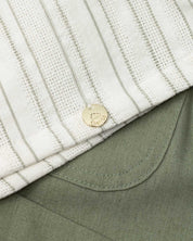 Conjunto en lino de blusa con moño en hombro y short verde para niña