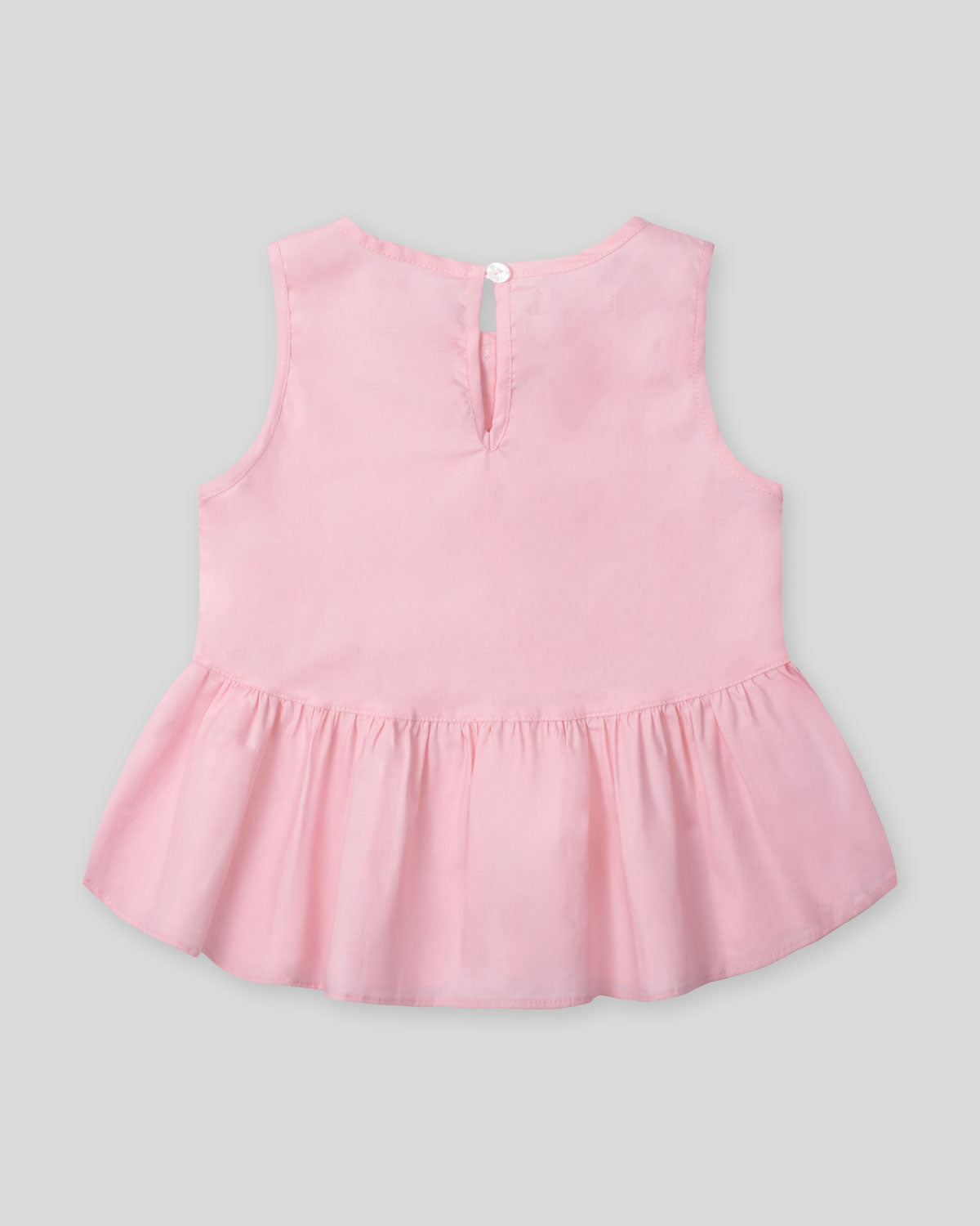 Blusa rosa con detalle de moñitos y bolero para niña