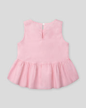 Blusa rosa con detalle de moñitos y bolero para niña