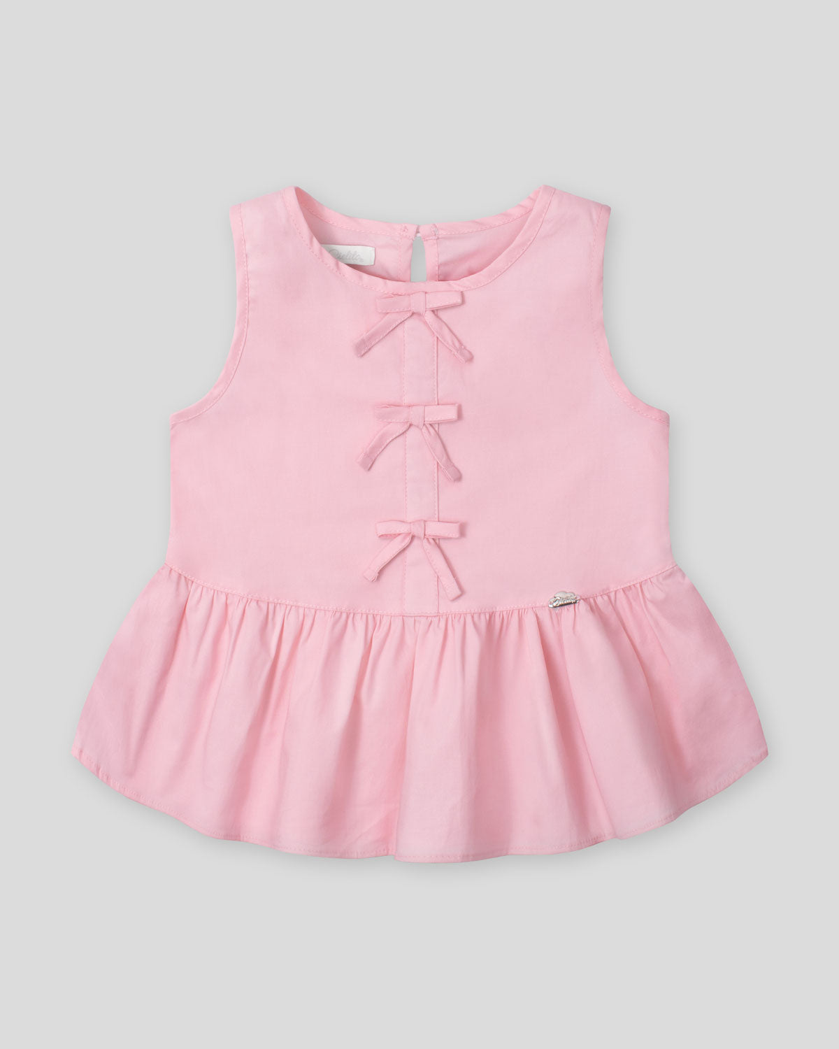 Blusa rosa con detalle de moñitos y bolero para niña