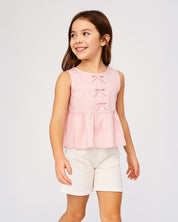 Blusa rosa con detalle de moñitos y bolero para niña