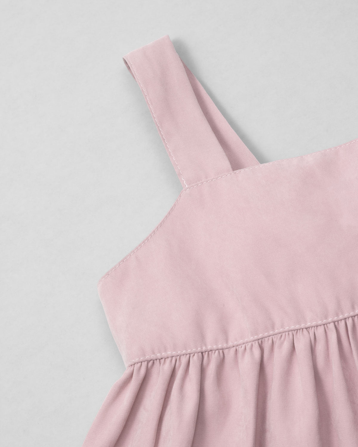 Blusa rosa pastel de tiras con moño en espalda para niña