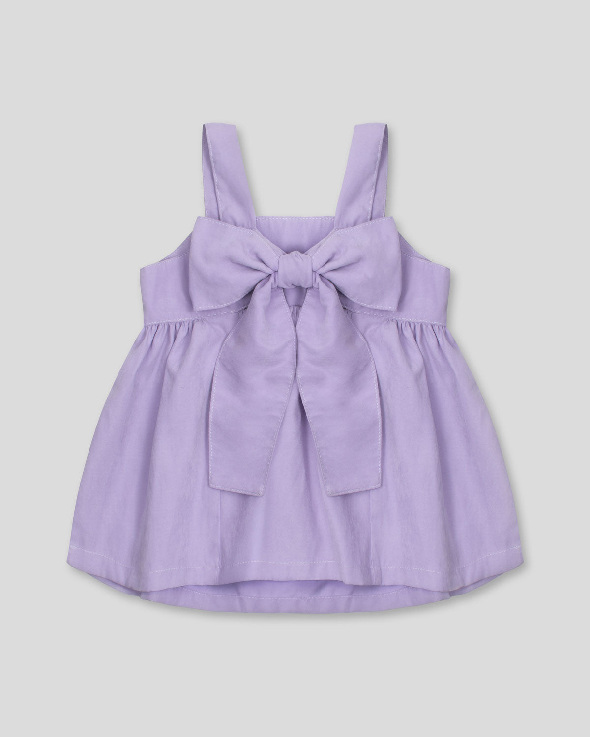 Blusa lila de tiras con moño en espalda para niña