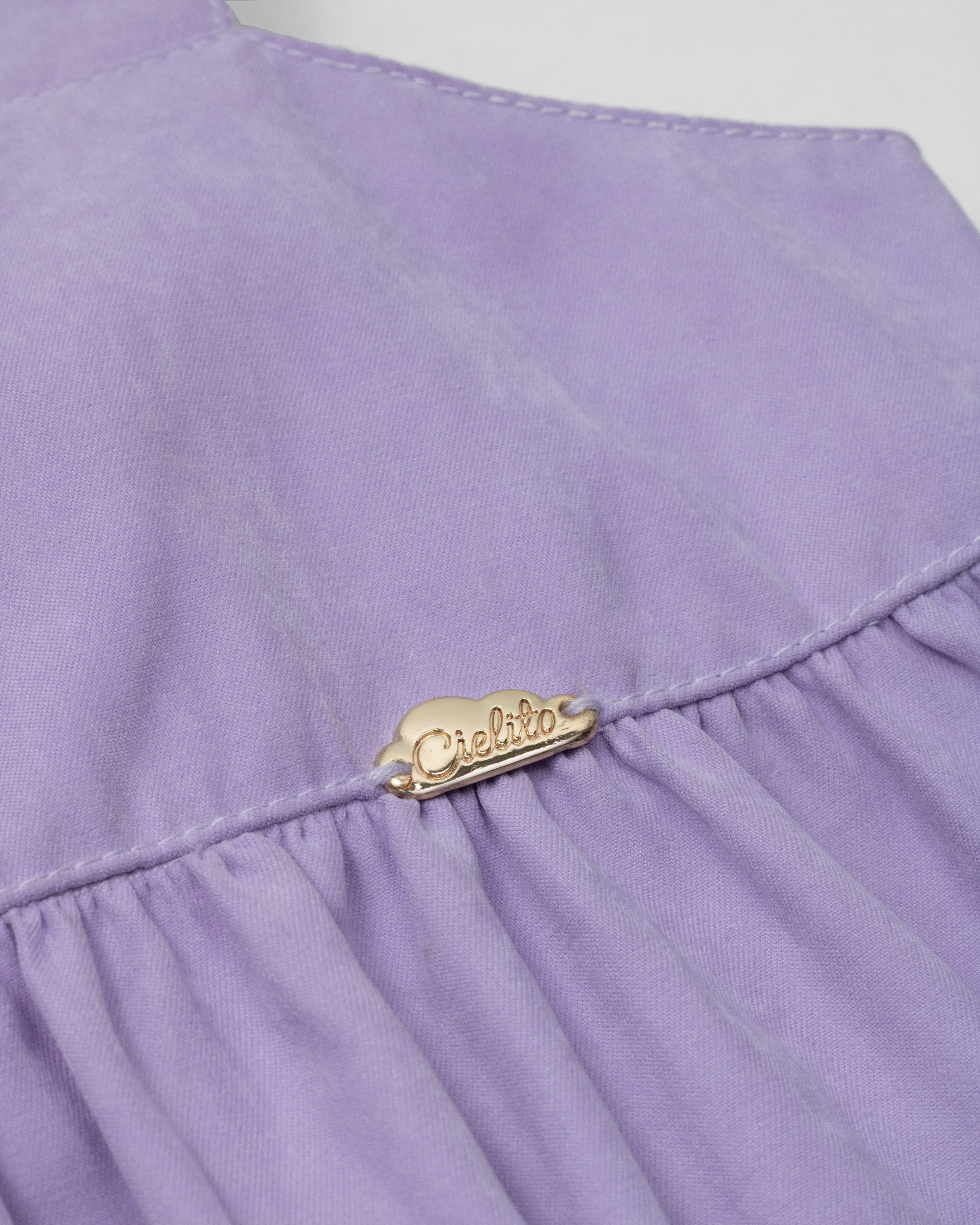 Blusa lila de tiras con moño en espalda para niña