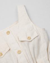 Enterizo en lino con botonadura y cinturón estampado para niña