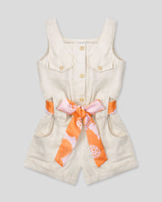 Enterizo en lino con botonadura y cinturón estampado para niña