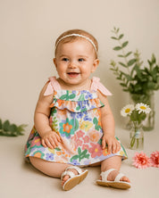 Vestido body con estampado de flores y detalle de moño rosa para bebé niña