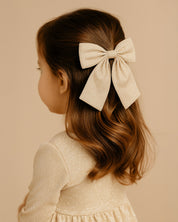 Moño pinza dorado para niña