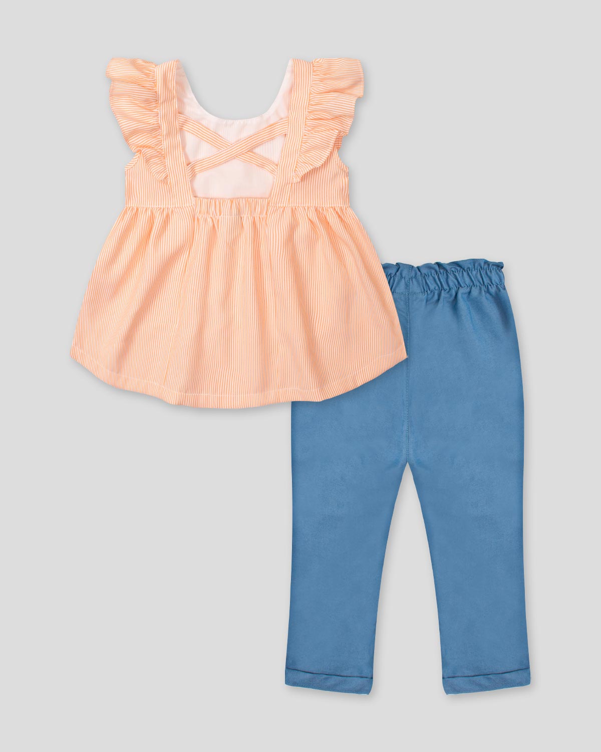 Conjunto blusa de líneas naranjas con bolero en manga y leggins chambray con detalle de moño para bebé niña