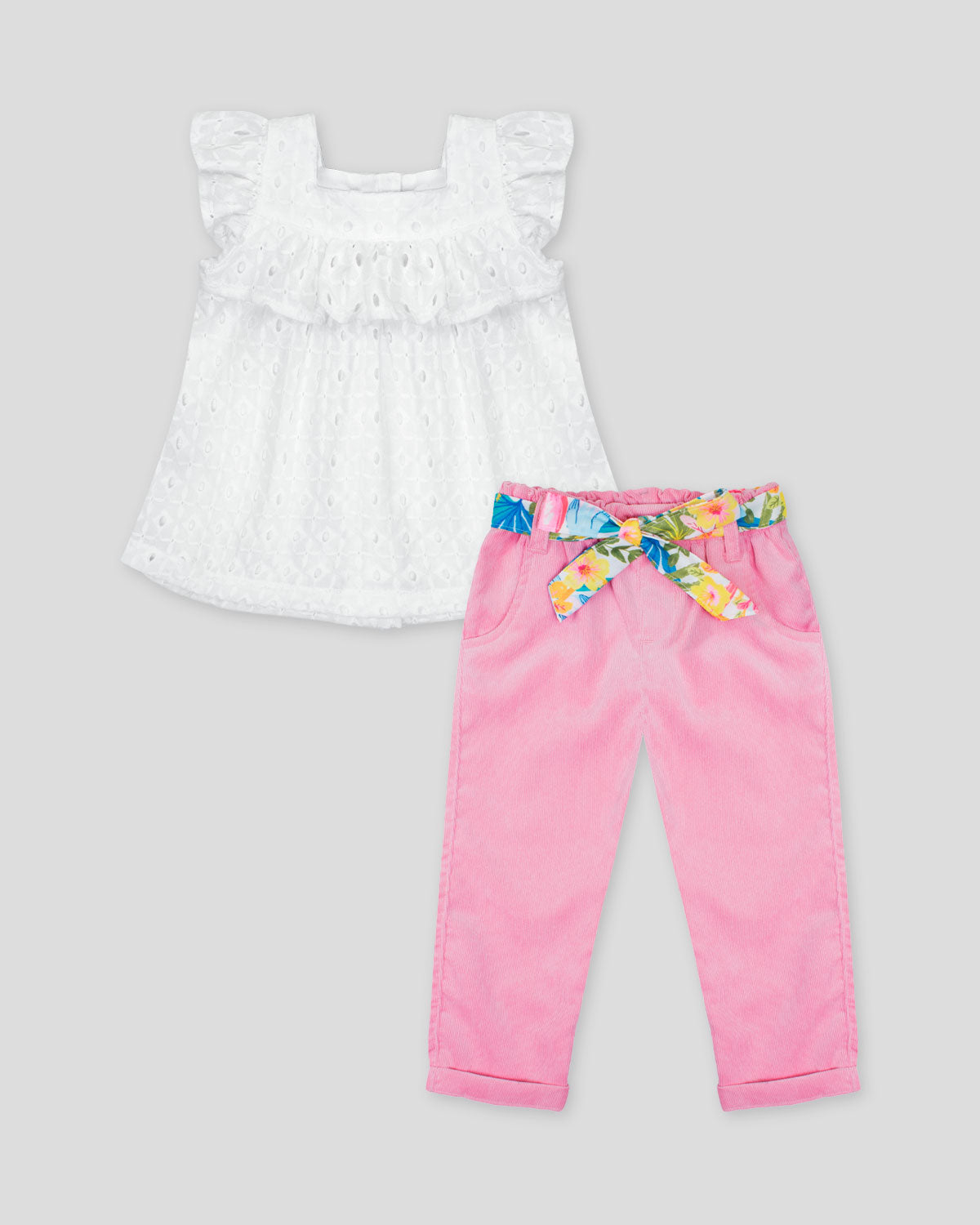 Conjunto blusa blanca en tela hoja rota y pantalón rosado con cinturón estampado para bebé niña