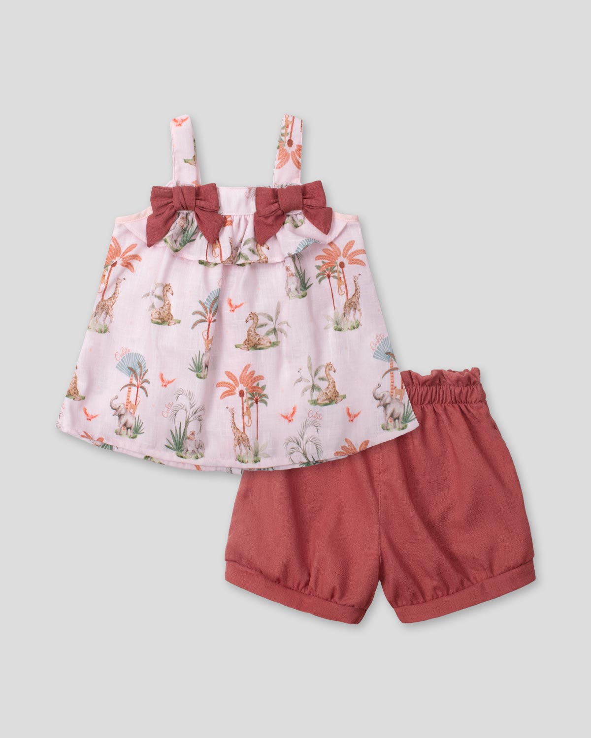 Conjunto blusa en lino estampada con moñitos y short rojo para bebé niña