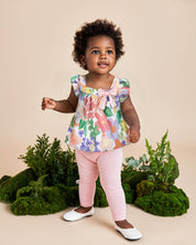 Conjunto blusa con estampado de flores de mangas con boleros, moñito rosa y leggins para bebé niña