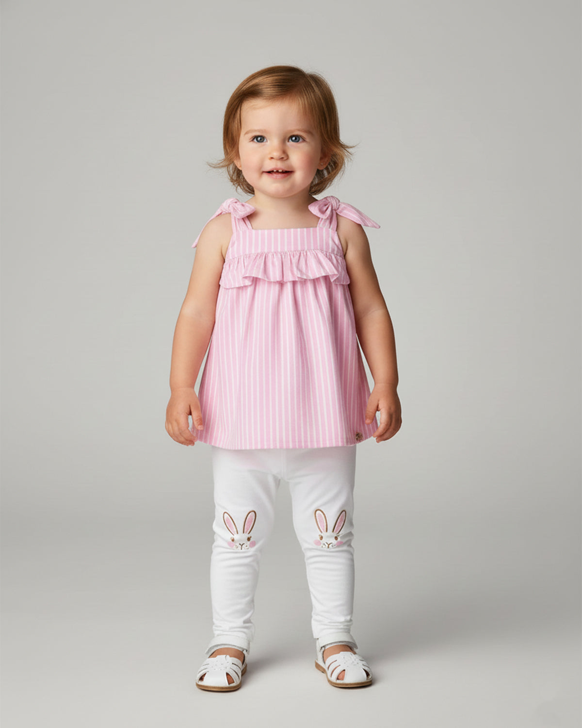 Conjunto blusa rosa con estampado de líneas y leggins con conejitos para bebé niña