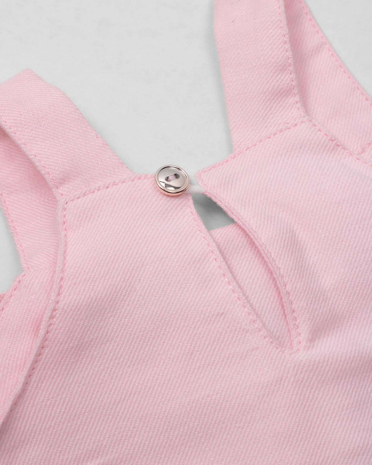 Conjunto blusa de tiras con moño rosa y short beige para bebé niña