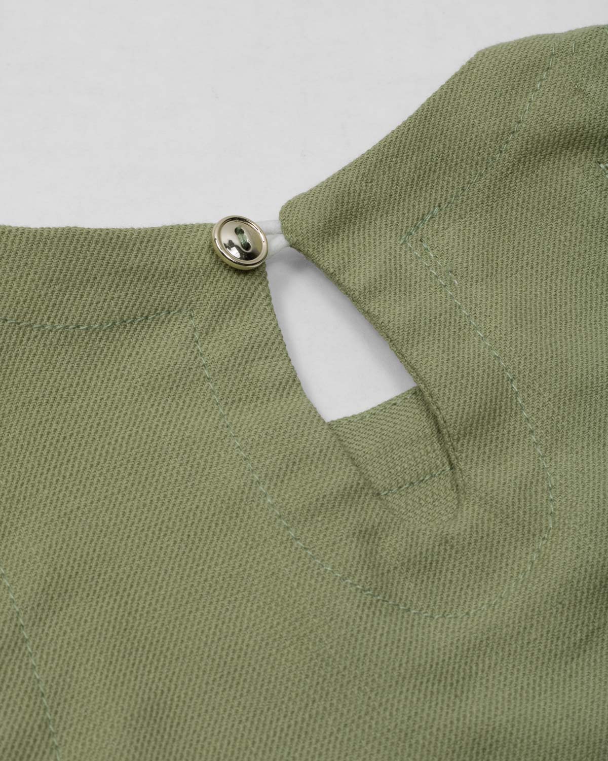 Conjunto blusa manga sisa verde con moñitos y  short rosa para bebé niña