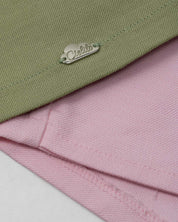 Conjunto blusa manga sisa verde con moñitos y  short rosa para bebé niña