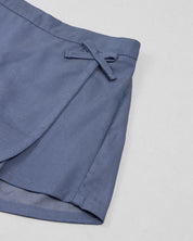 Conjunto blusa amarilla de tiras con moño y falda short azul para bebé niña