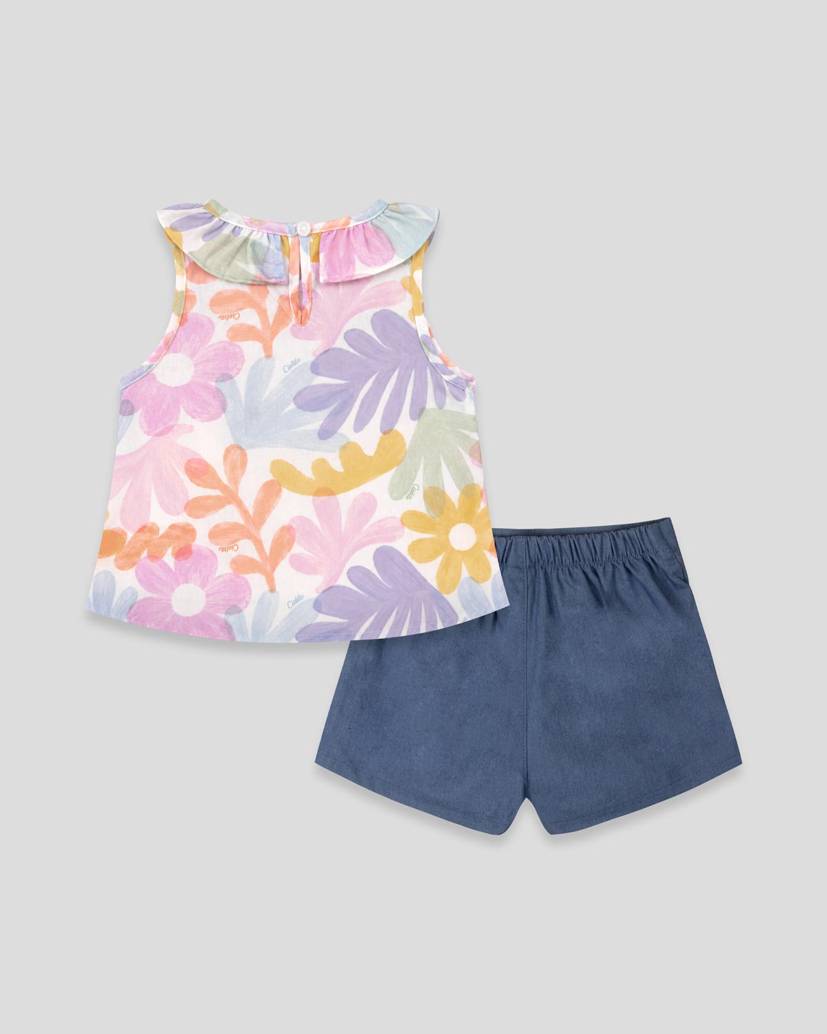 Conjunto blusa estampada con bolero y falda short con moñitos azul para bebé niña