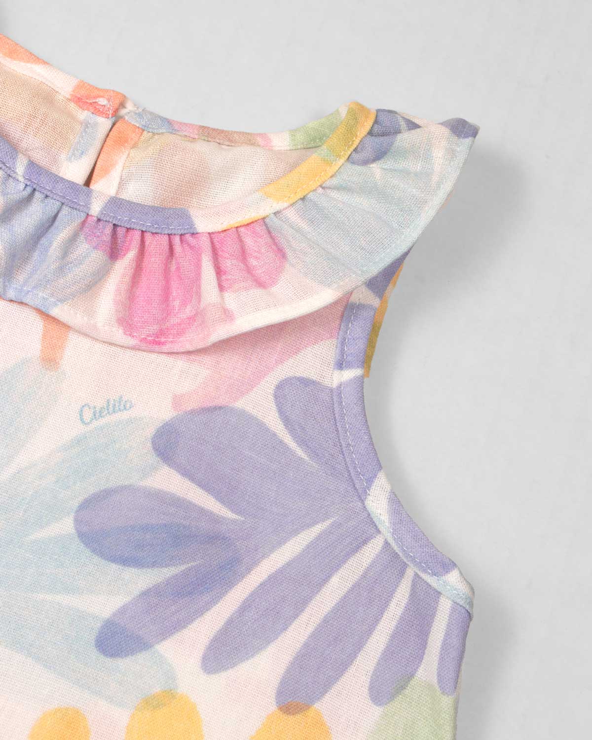 Conjunto blusa estampada con bolero y falda short con moñitos azul para bebé niña