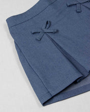 Conjunto blusa estampada con bolero y falda short con moñitos azul para bebé niña