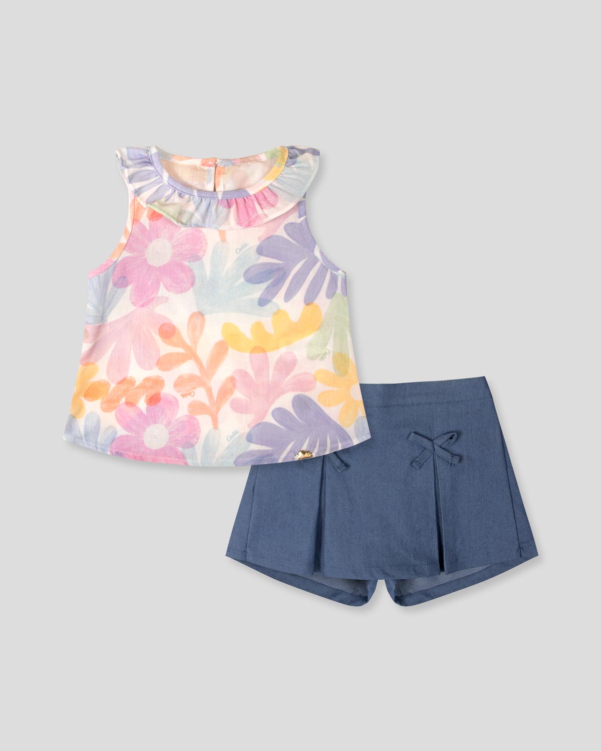 Conjunto blusa estampada con bolero y falda short con moñitos azul para bebé niña