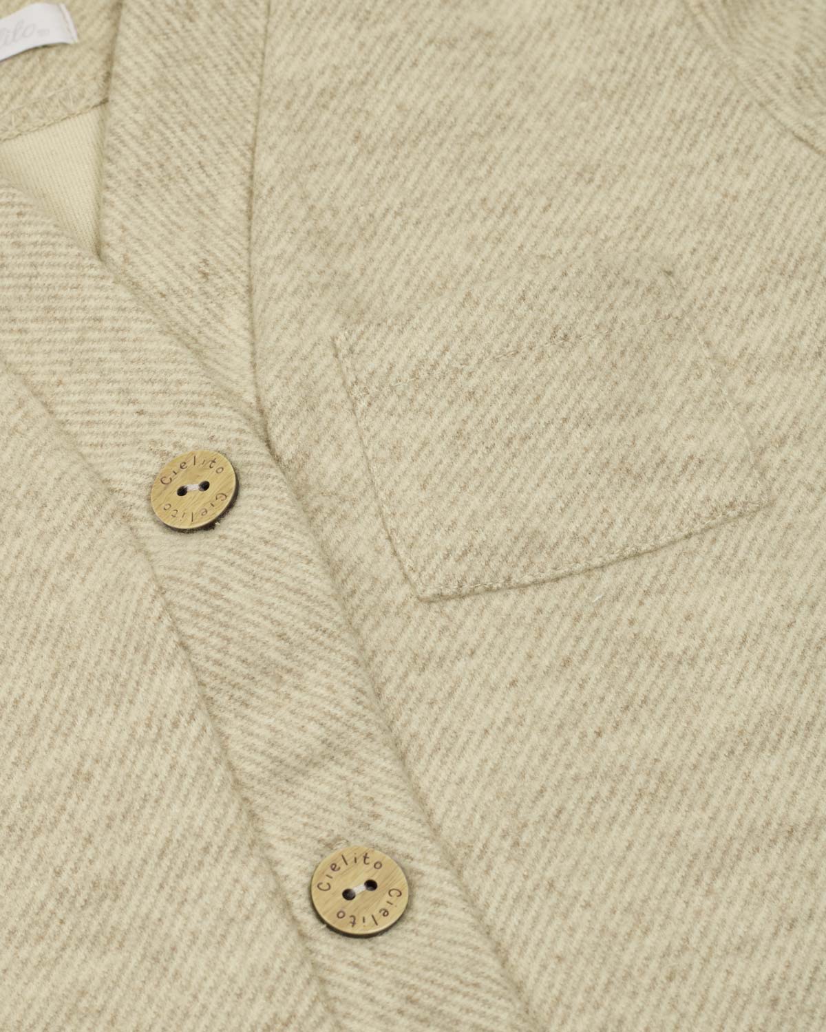 Saco beige de botones para bebé niño