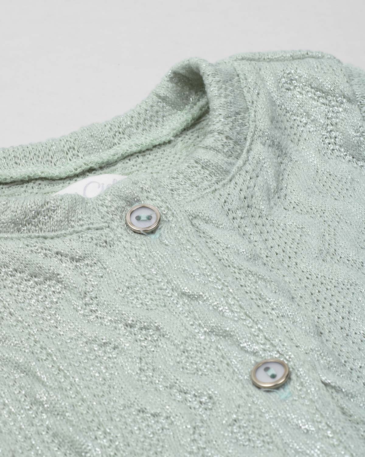 Saco en tela tejida verde con brillos y botones para bebé niña