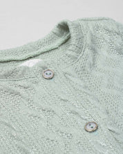 Saco en tela tejida verde con brillos y botones para bebé niña
