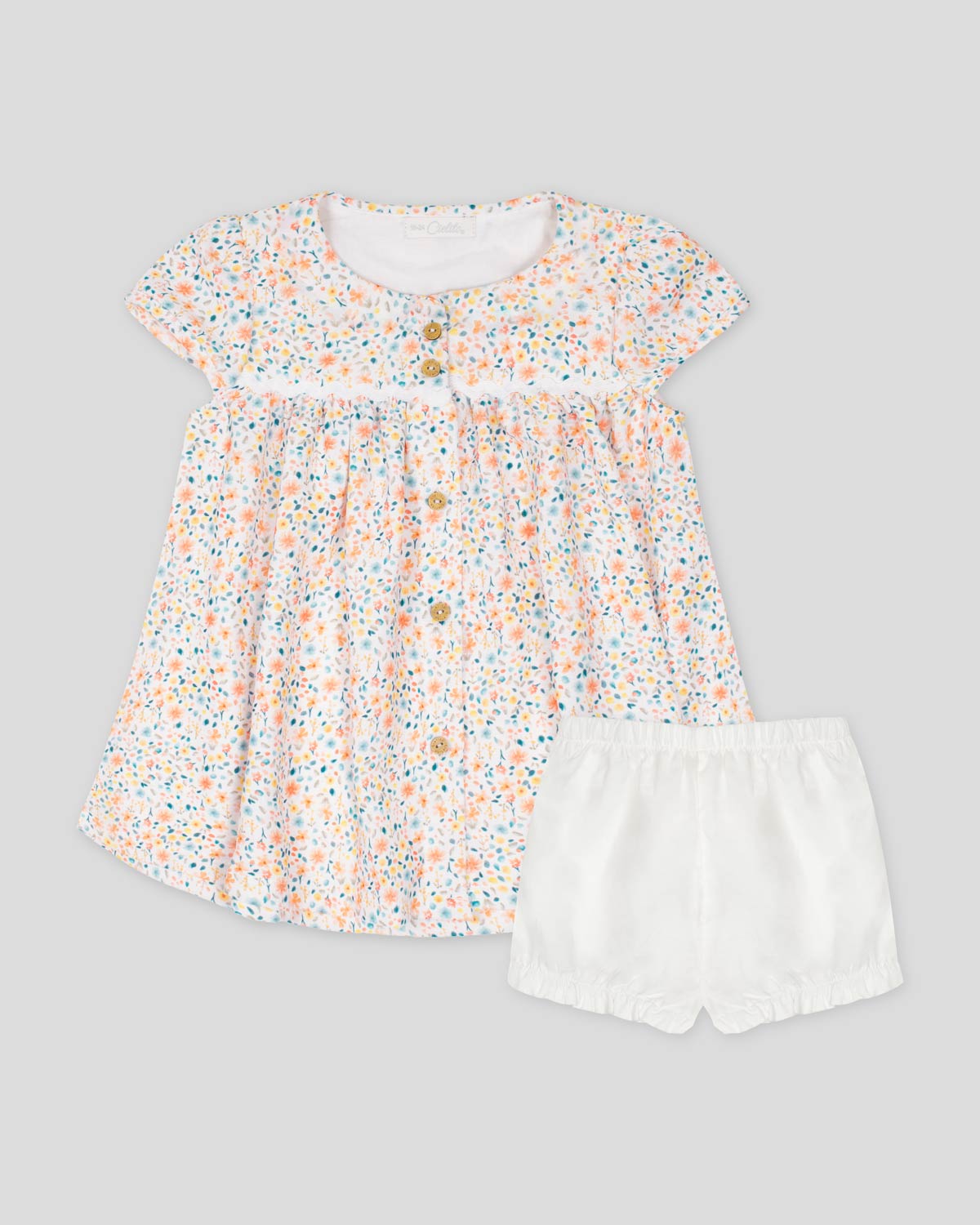 Vestido de botones con estampado miniprint y calzón blanco para bebé niña