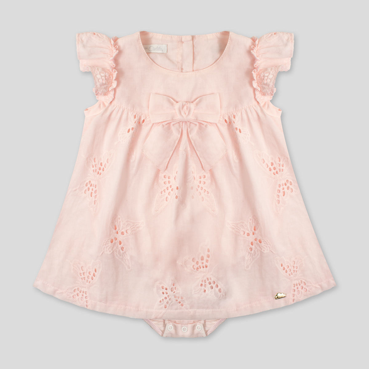 Vestido body rosa en tela hoja rota con detalle de moño para bebé niña