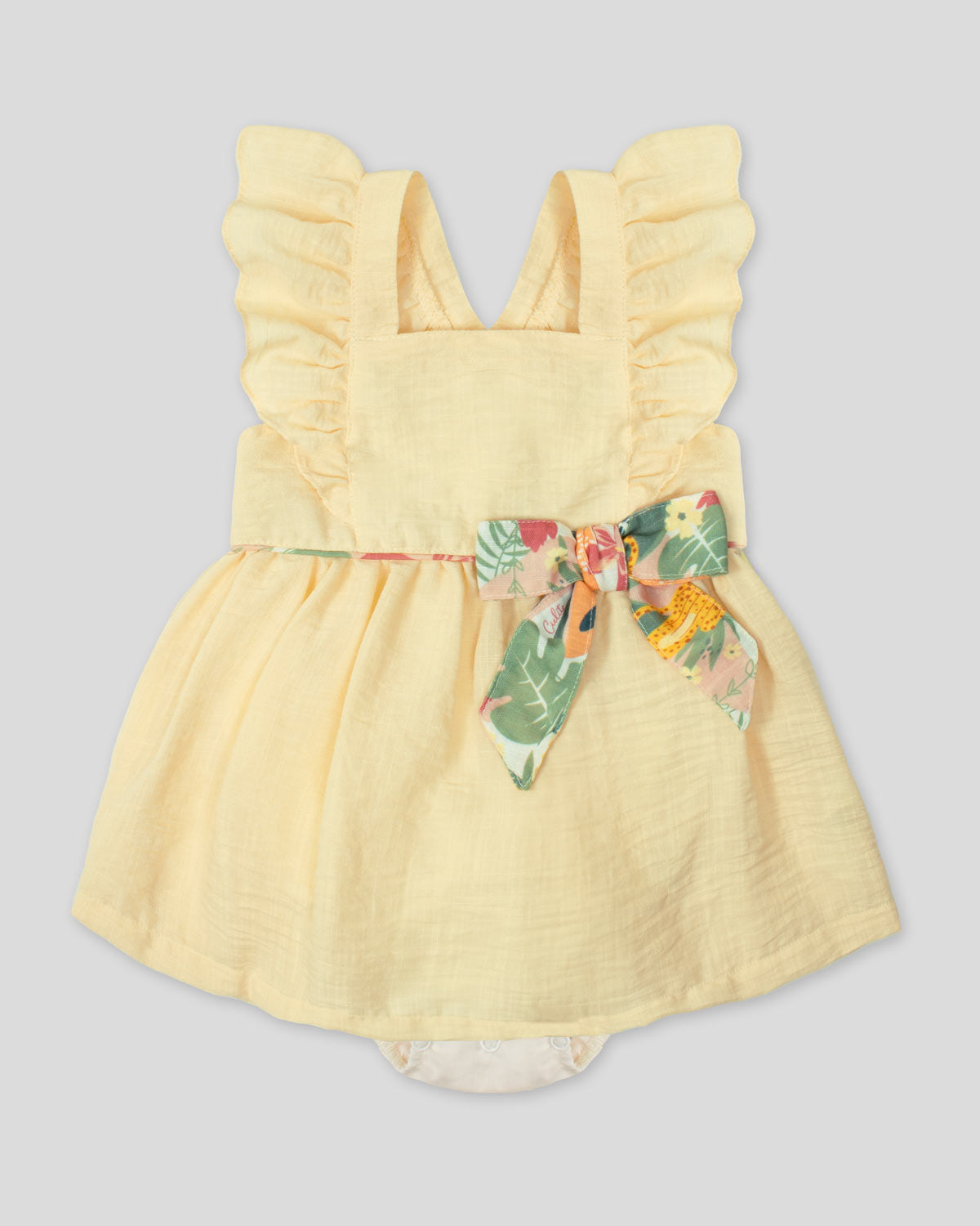 Vestido body amarillo pastel en lino de tiras con bolero y moño estampado para bebé niña