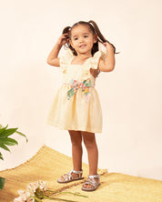 Vestido body amarillo pastel en lino de tiras con bolero y moño estampado para bebé niña